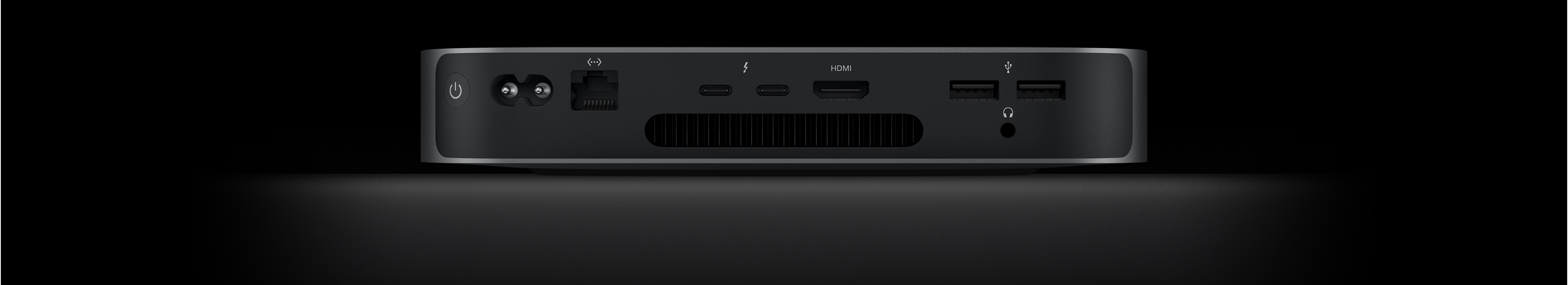Vue arrière de Mac mini montrant les deux ports Thunderbolt 4, les port HDMI, les deux ports USB-A, la prise pour écouteurs, le port Gigabit Ethernet, le port d’alimentation et le bouton de mise en marche.