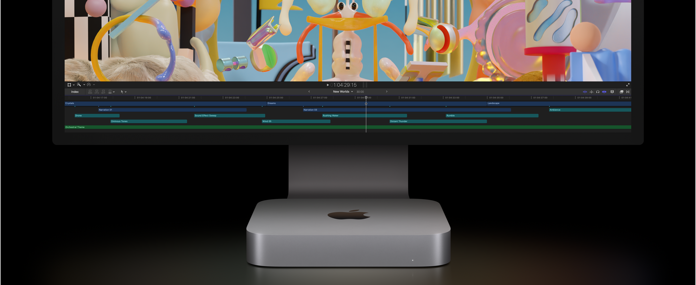 Vue avant de Mac mini, ainsi que du Studio Display, où s’affiche un projet de montage vidéo dans Final Cut Pro.